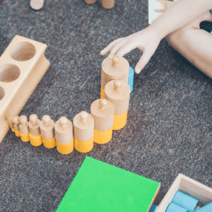 student plays with montessori blocks with homeschool tutor